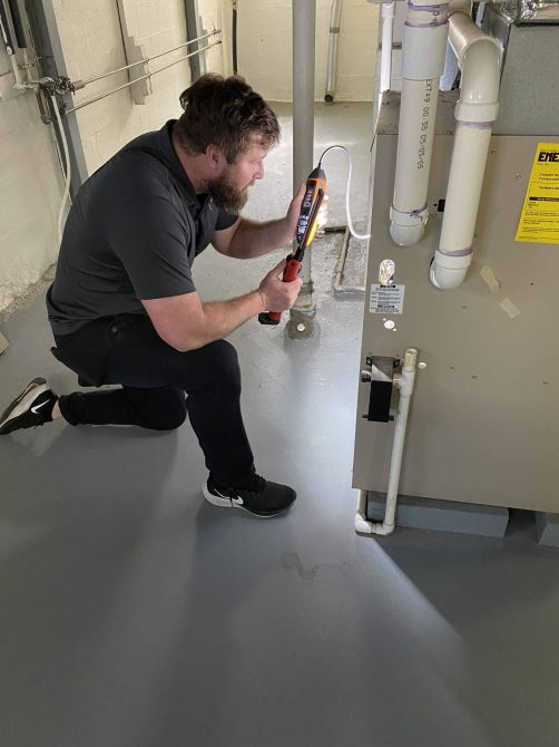 Noah inspecting a furnace